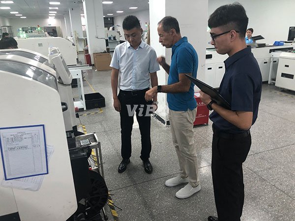 Customer visiting an LED display factory